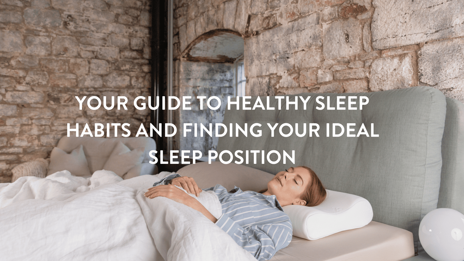 person lying on their back in blue pyjamas in bed