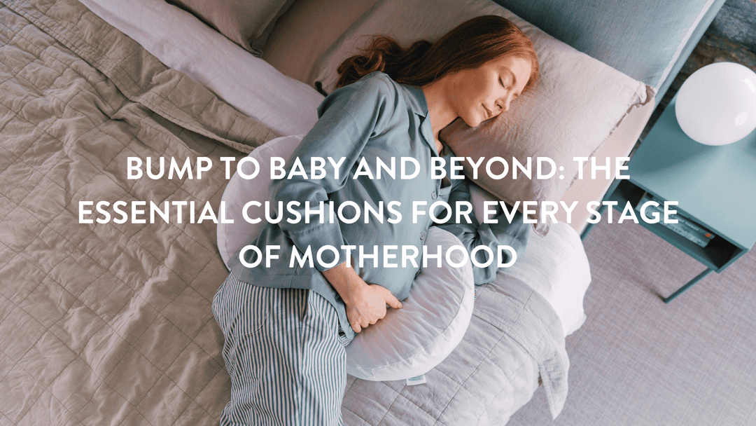 Person lying in bed with pregnancy cushions supporting front and back