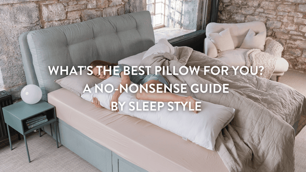 Person sleeping on a double bed with a Putnams body pillow