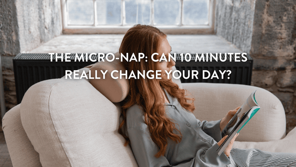 A woman relaxing on a couch, reading a magazine, with a cozy setting. 