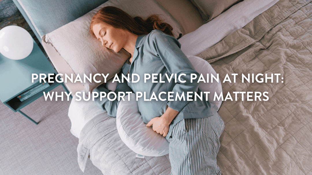 Pregant woman lying in bed suppoprted by the Putnams Back & Bump Pillow with British Wool Filling