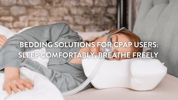 person sleeping in bed wearing a CPAP mask and using a Putnams CPAP pillow for comfort