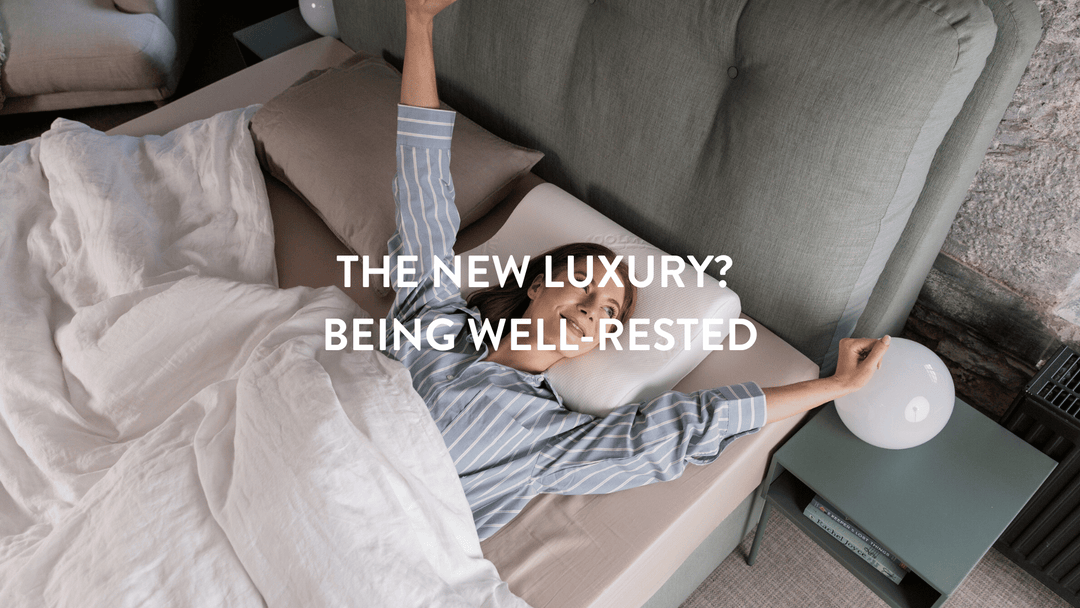 person waking up being well rested in a double bed