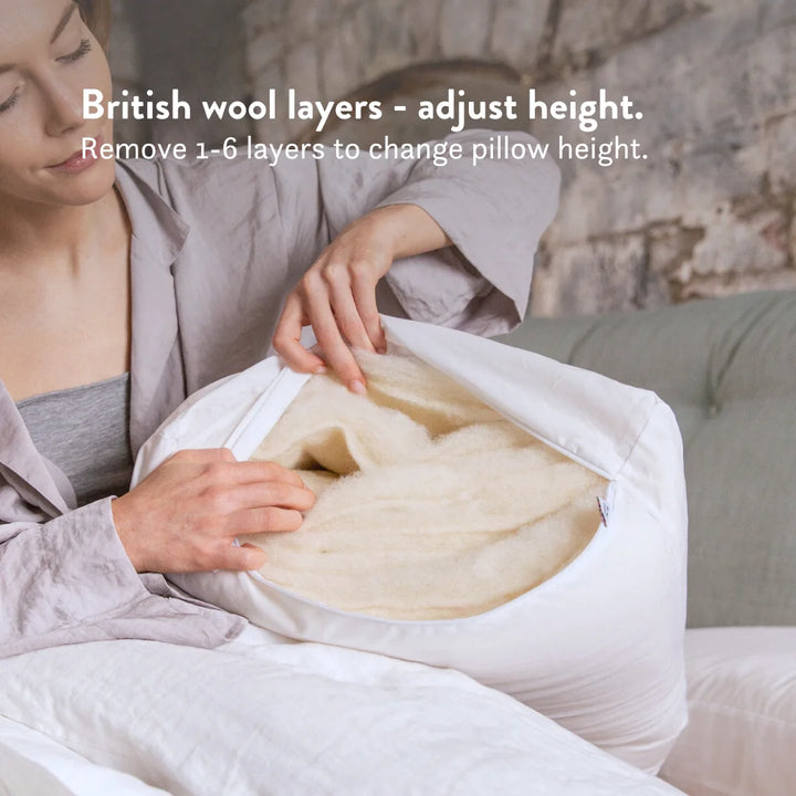 British wool height adjustable pillow with a 100% cotton cover. Remove 1-6 layers of wool to change the pillow height.