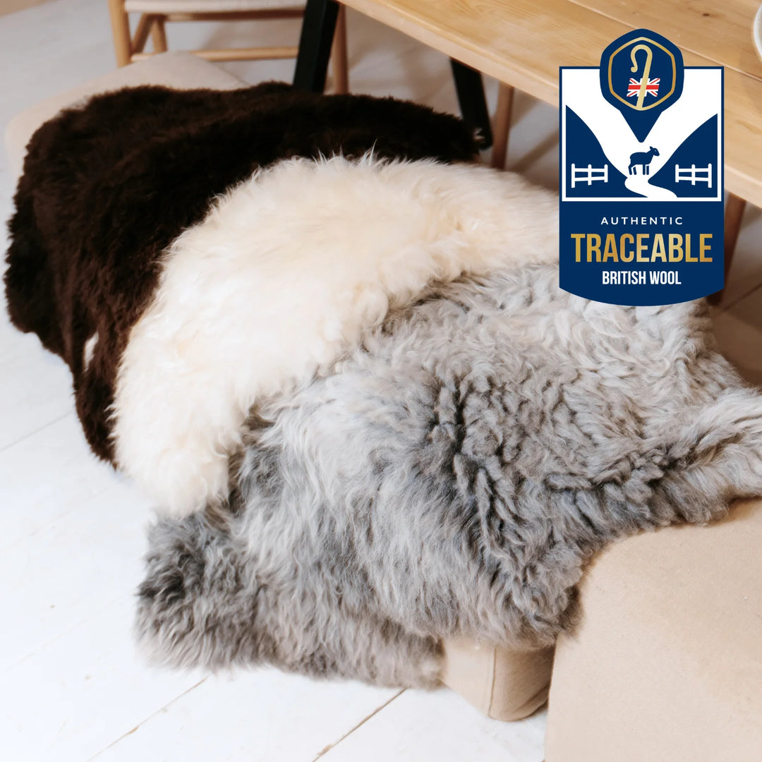 real sheepskin British rug throw cream grey & brown super soft long pile very fluffy on a chair